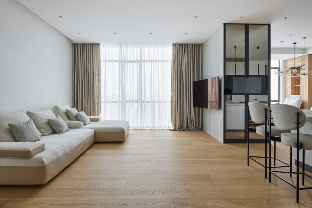 A Modern Living Room In An Australian Home With Hybrid Flooring And White Furniture.